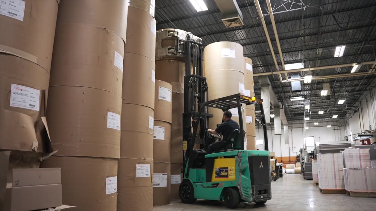 Paper rolls staged in the JD Graphic warehouse